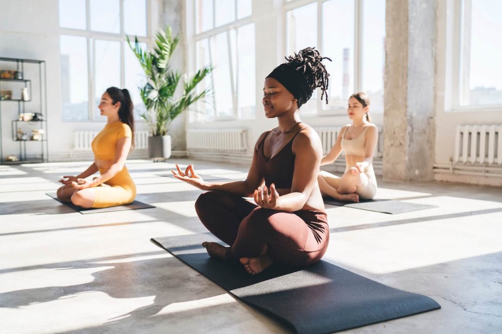 meditating-women-practicing-yoga-in-studio-2026-01-09-07-10-59-utc.jpg